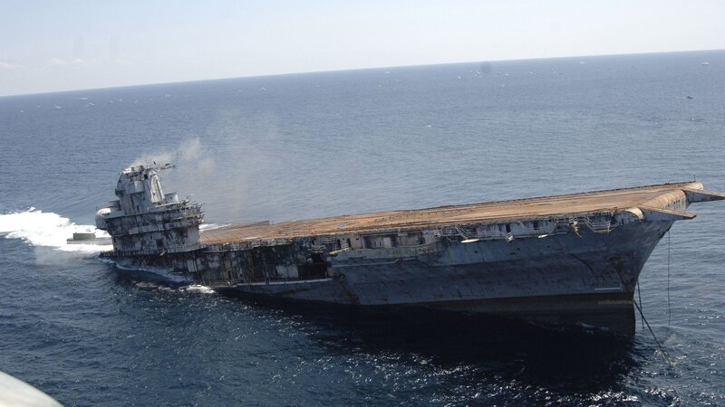 Sinking aircraft carrier at sea