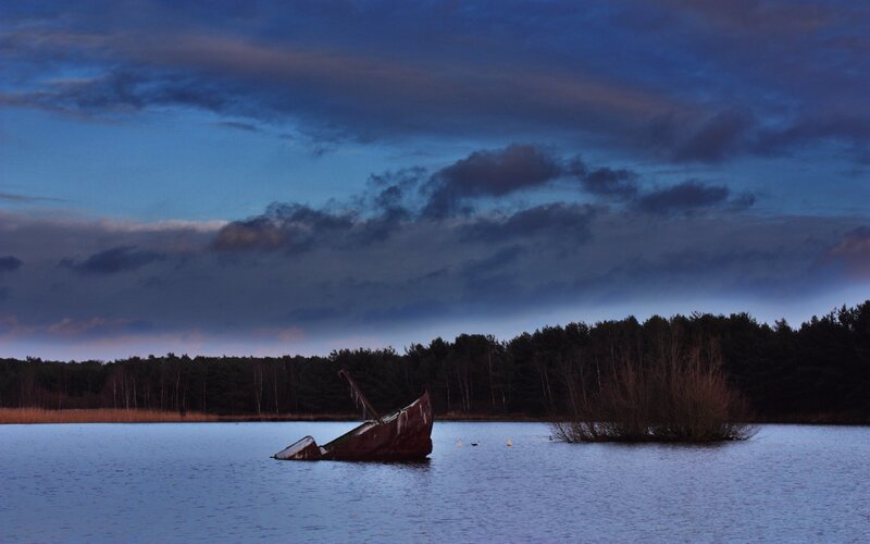 Sinking Boat in Lake