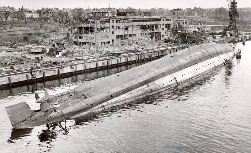 Sinking submarine in a war-torn port