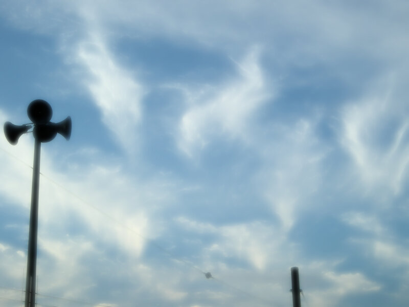 Siren against cloudy sky