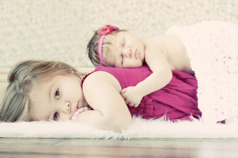 Sister Holding Baby