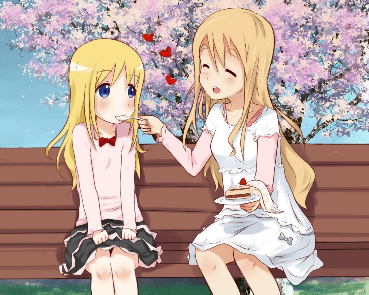 Sisters sharing cake