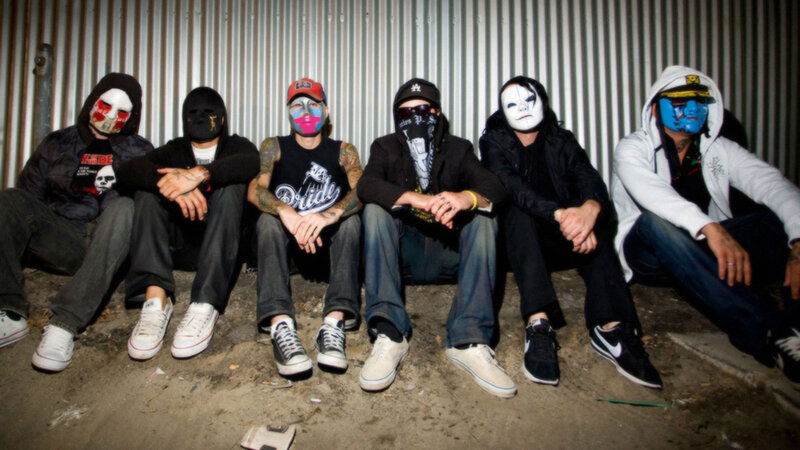 Six Masked People Sitting