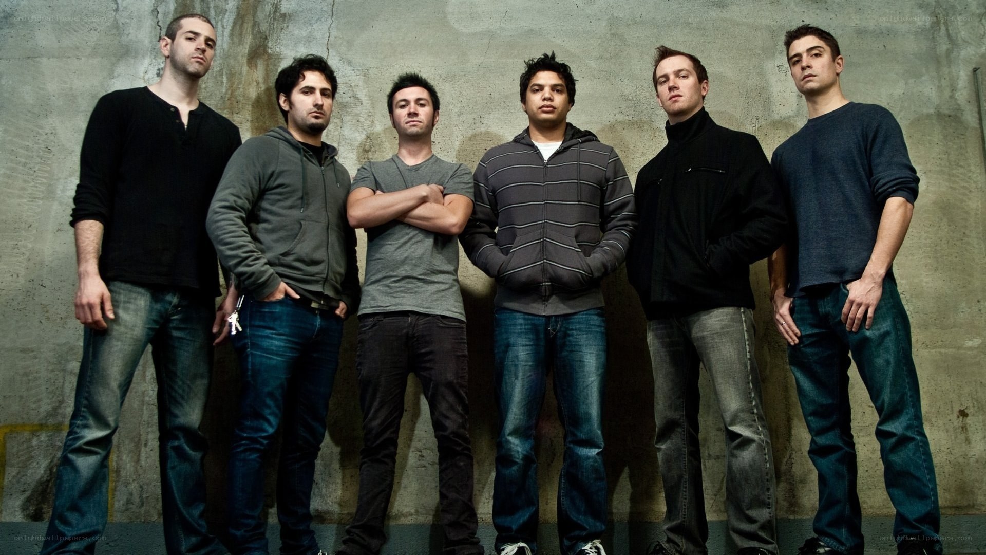six men standing in a row