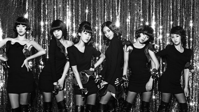 six women in black dresses