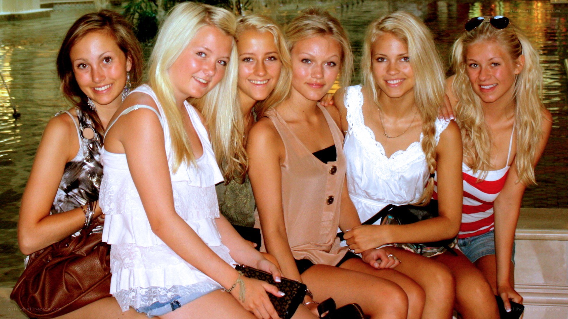 six young women posing together