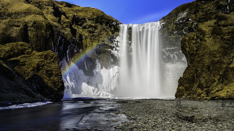 Skógafoss Waterfall — Blue, Dramatic, Afternoon, Photograph, Rainbow