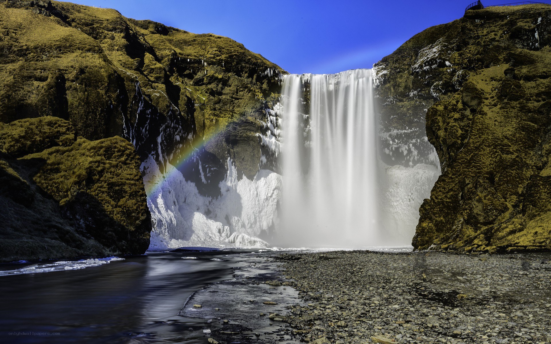Skógafoss waterfall with rainbow