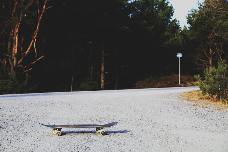 Skateboard on a forest road