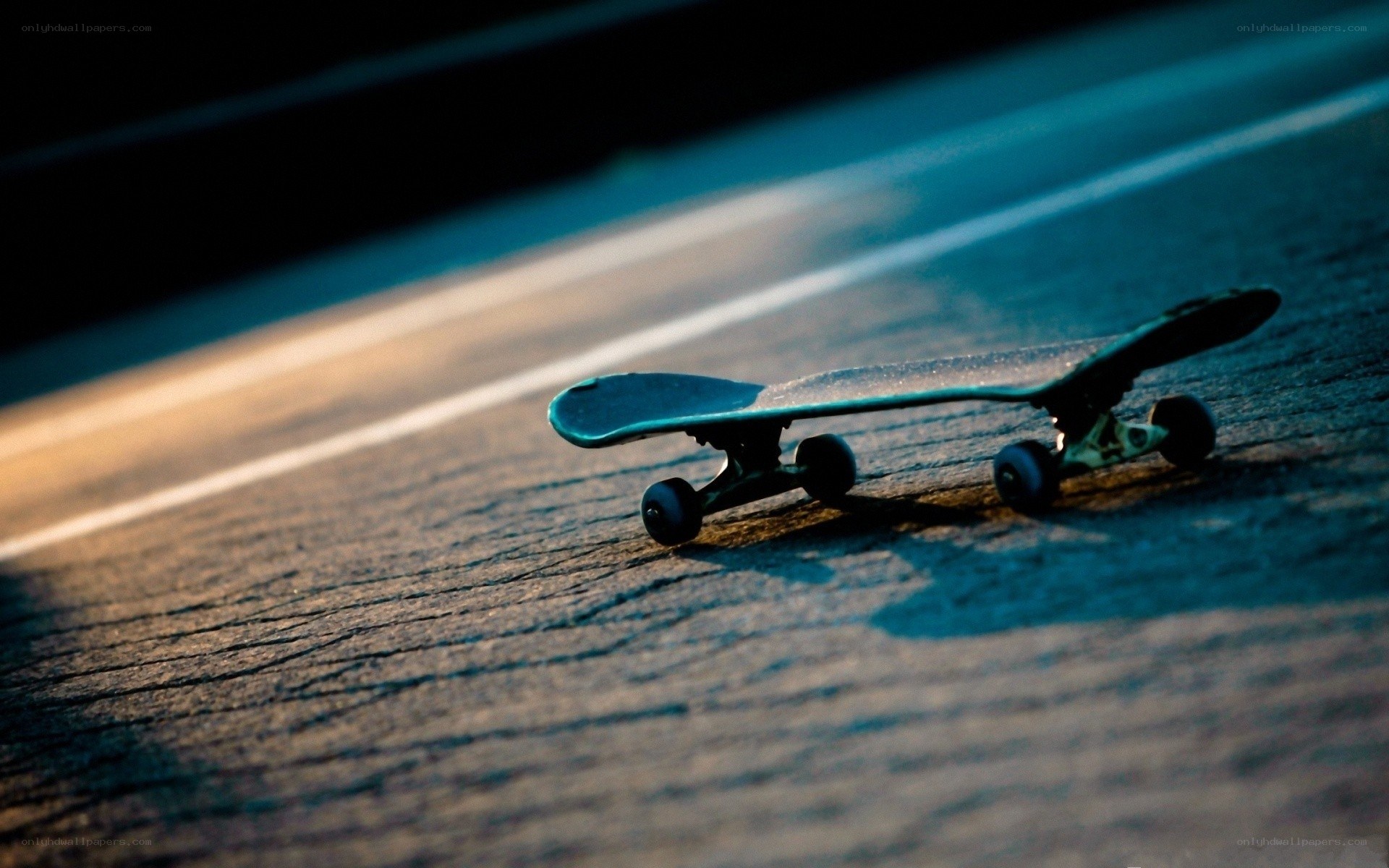Skateboard on pavement at night