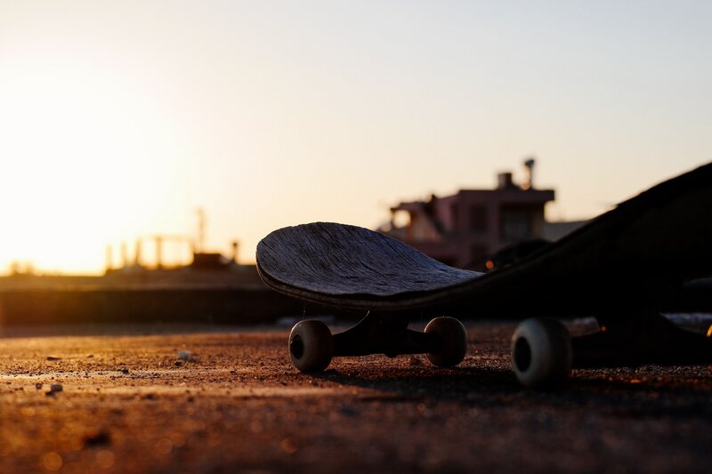Skateboard on Pavement — Brown