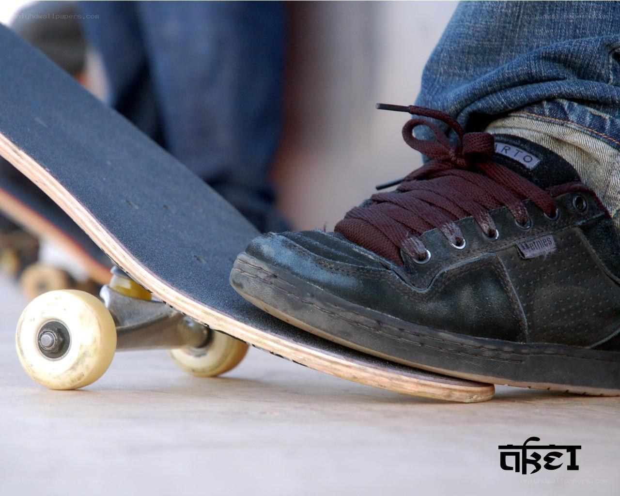 skateboarder's foot on deck