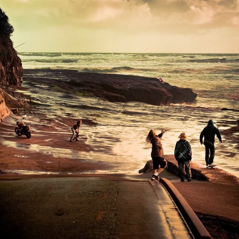 Skateboarders at the beach
