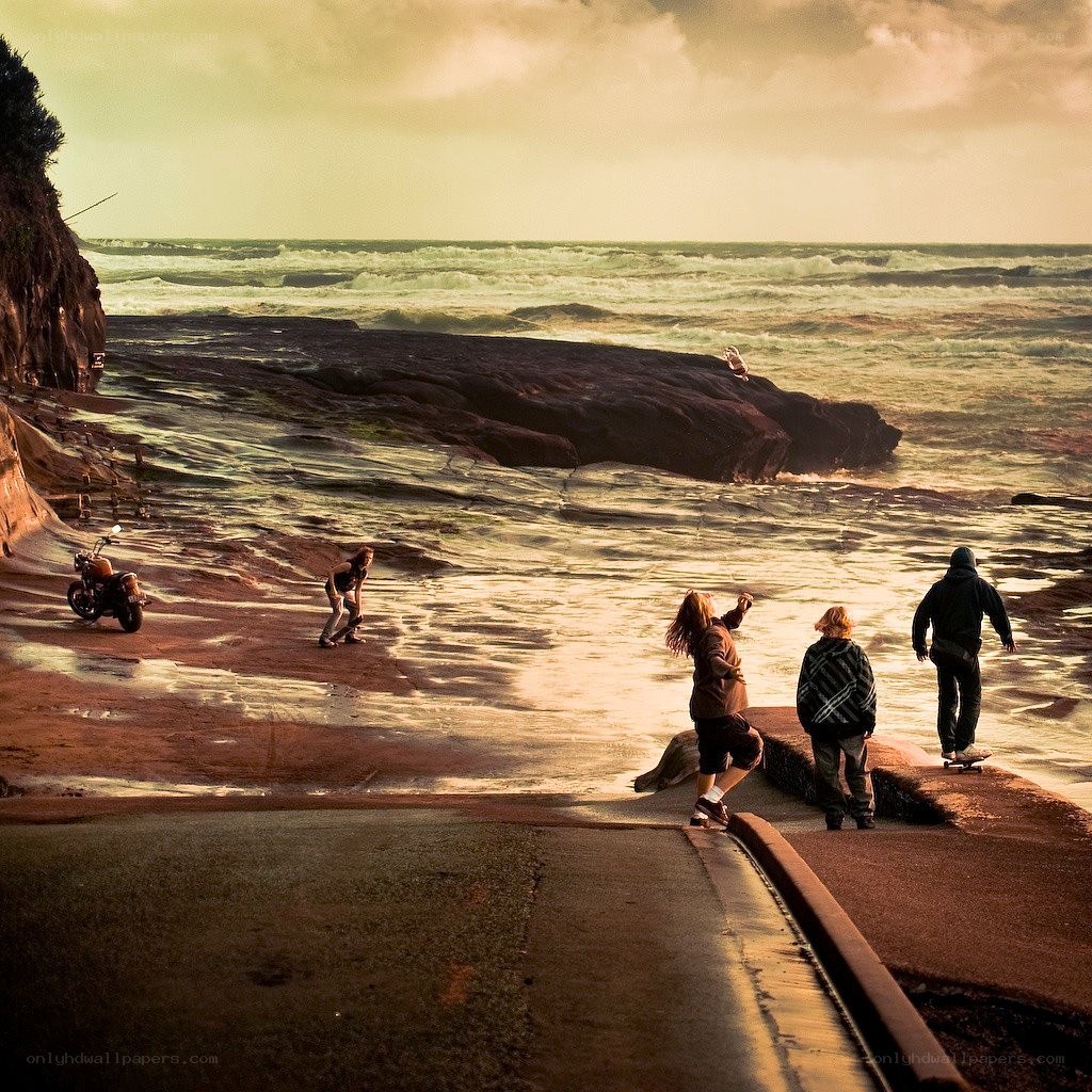 Skateboarders at the beach