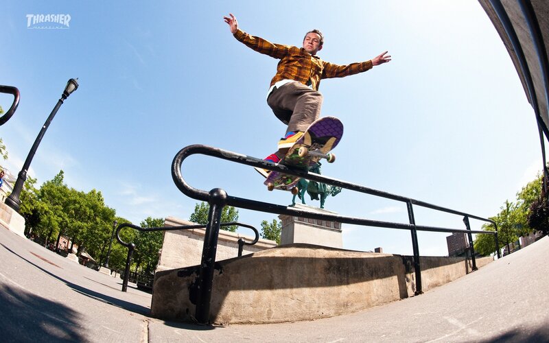 Skater grinding on a rail