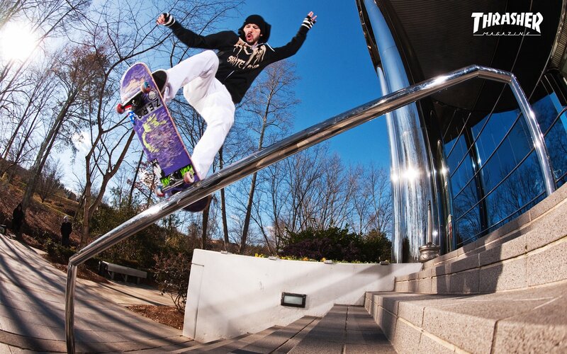 skater grinding rail