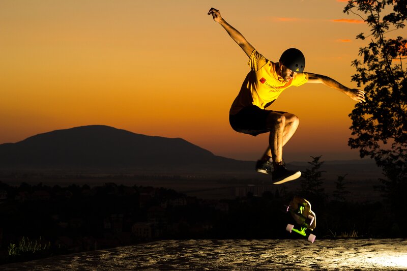 Skater in mid-air at sunset
