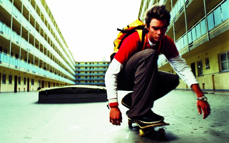 Skater in urban courtyard