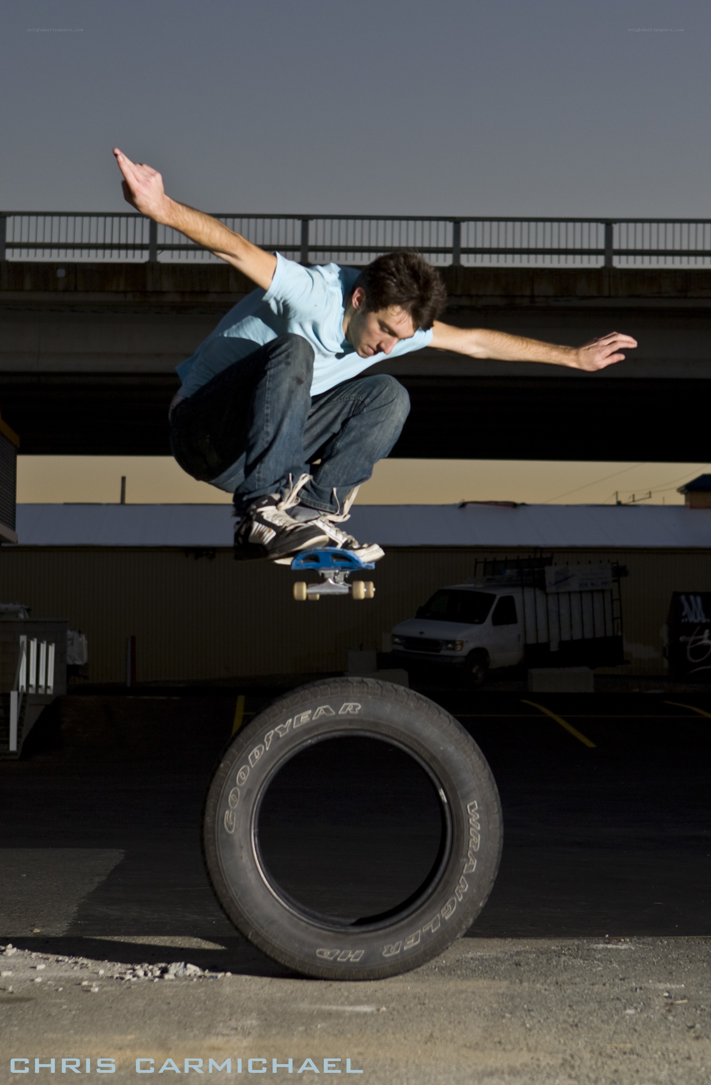Skater jumping over a tire