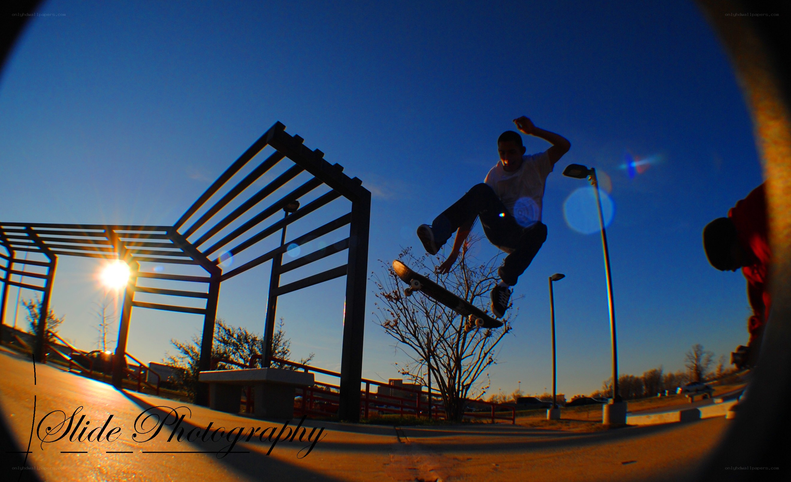 Skater mid-air at sunset