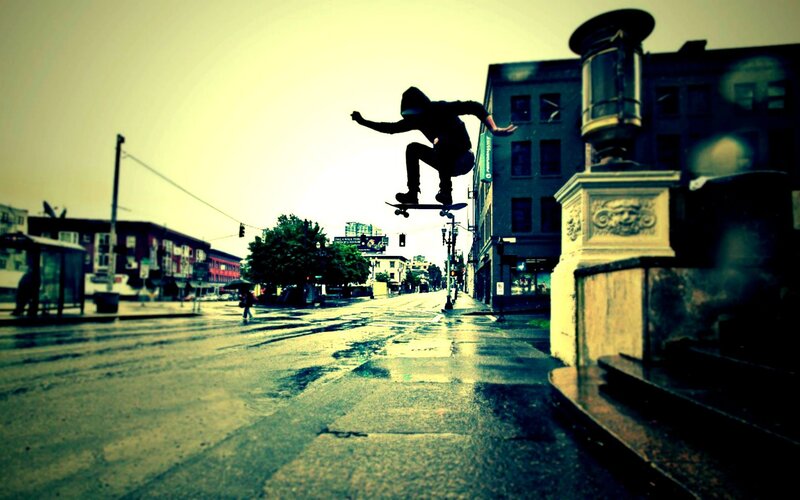 Skater mid-air in city street