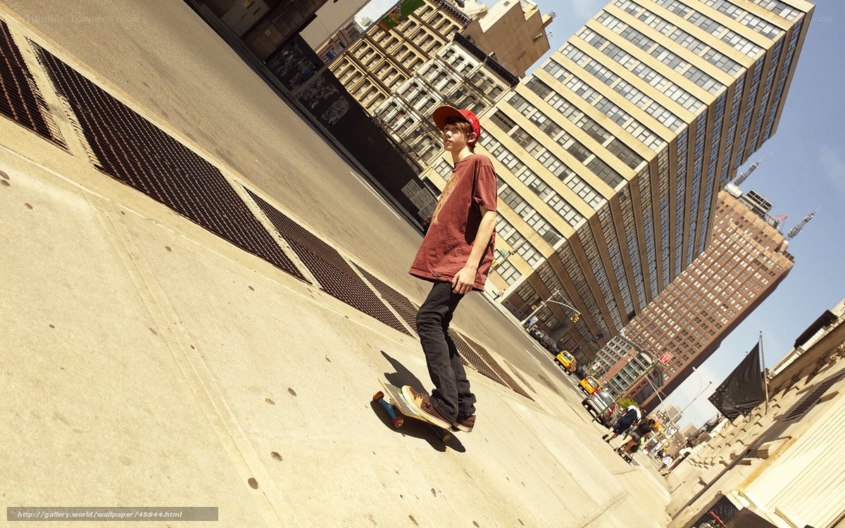 Skater on city sidewalk