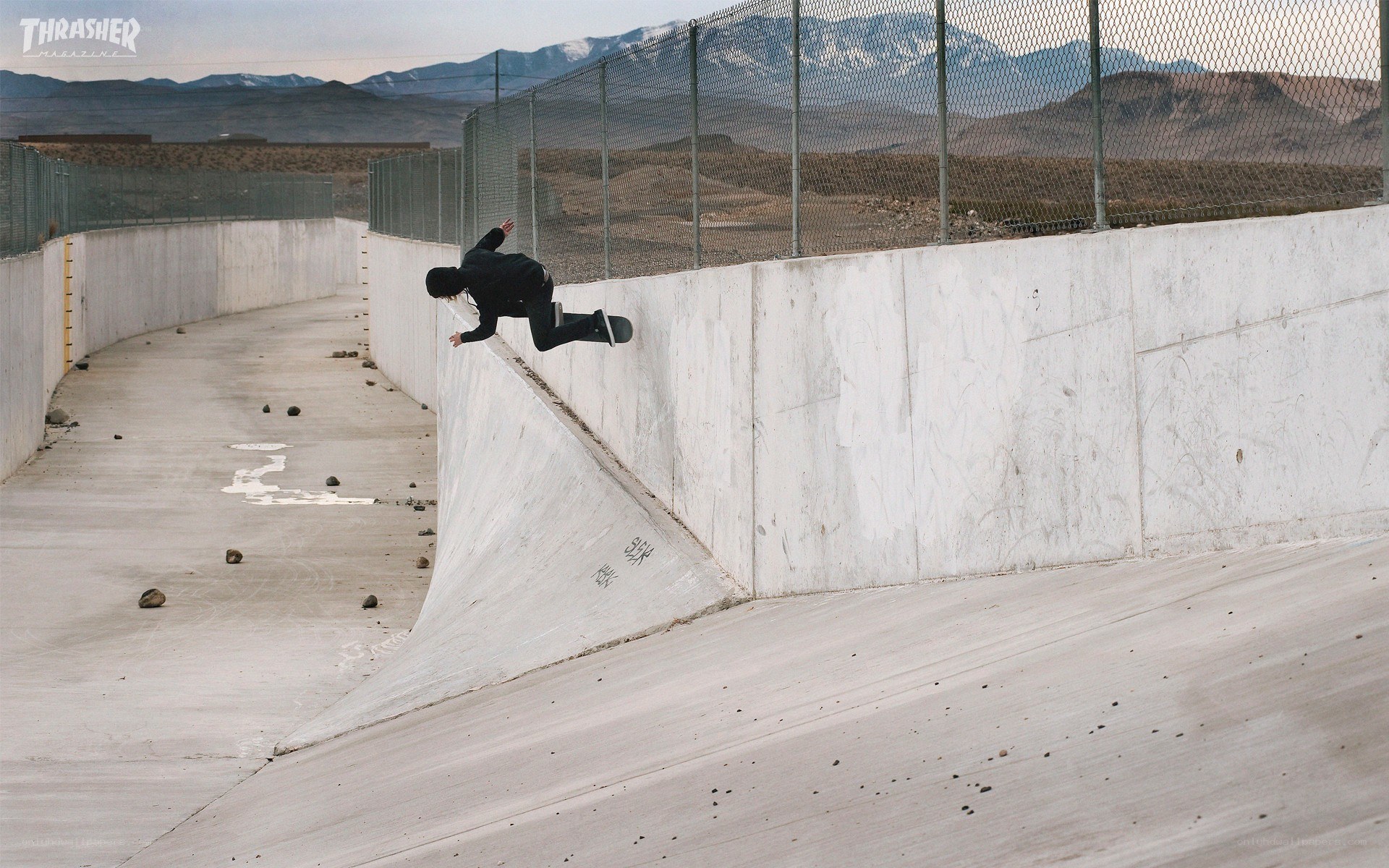 Skater on concrete ramp