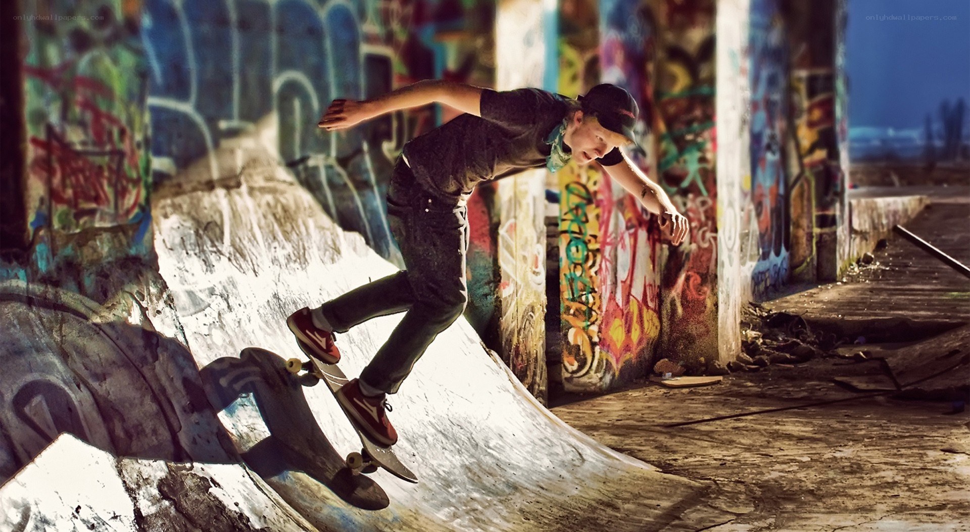 Skater on graffiti ramp