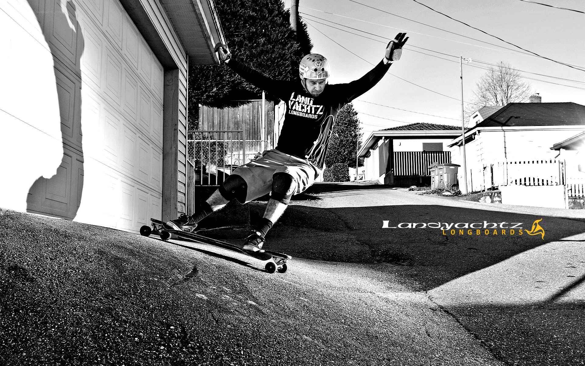 skater on longboard in driveway