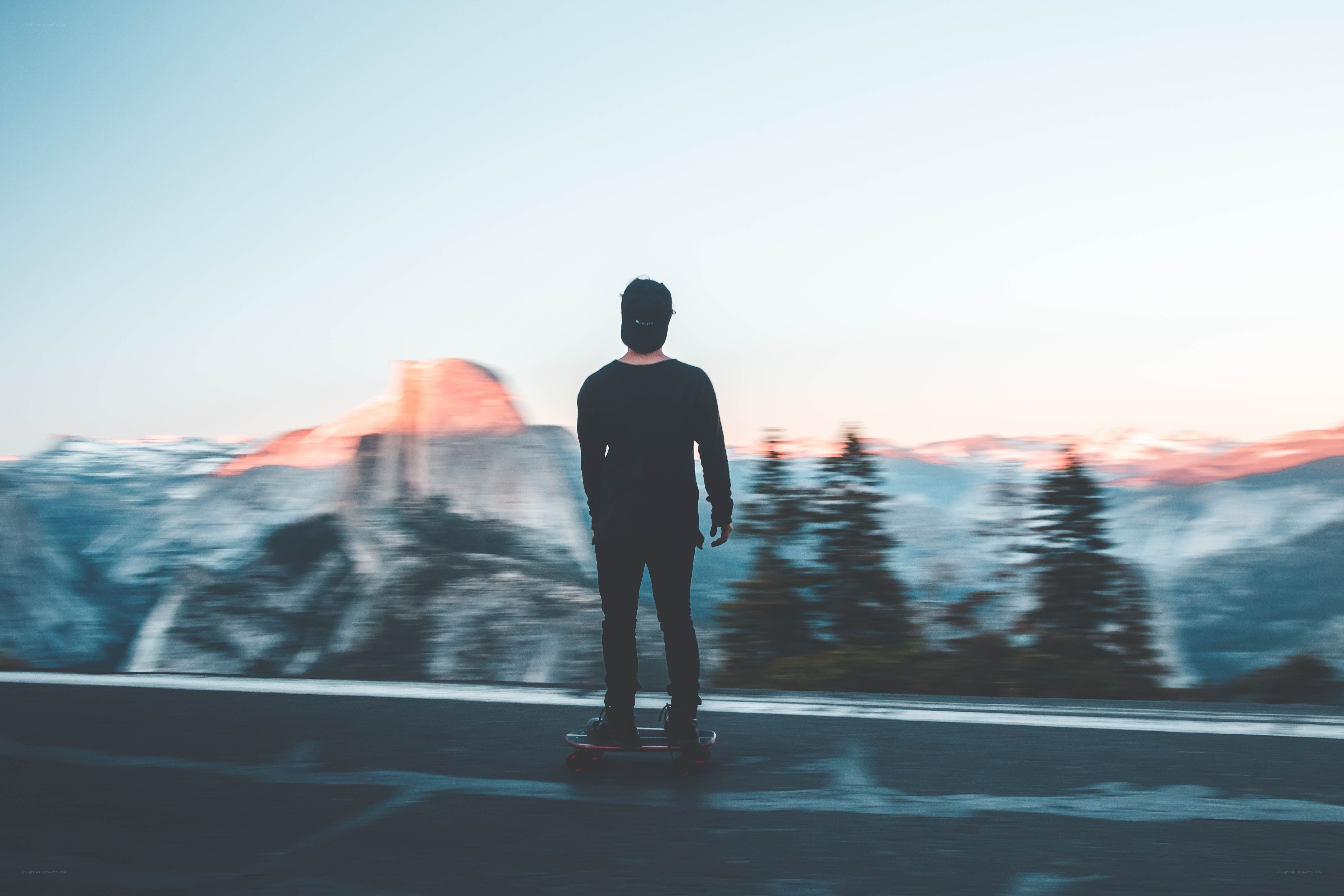 skater on mountain road