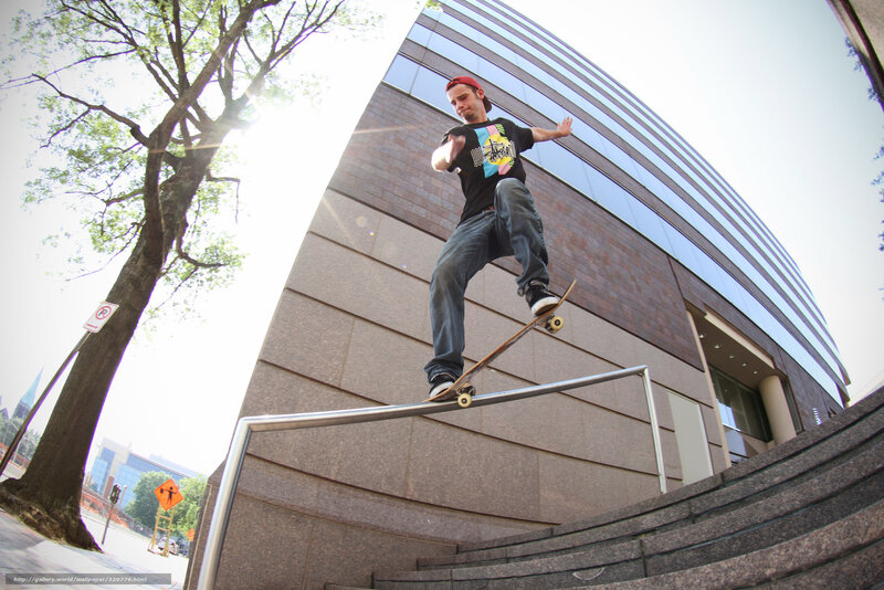 Skater on rail in city