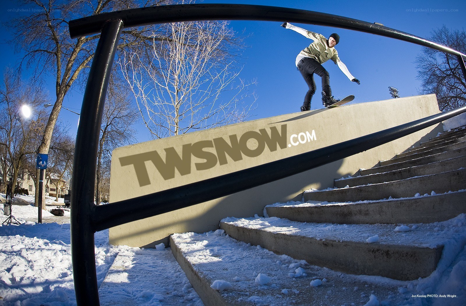 skater on rail in winter