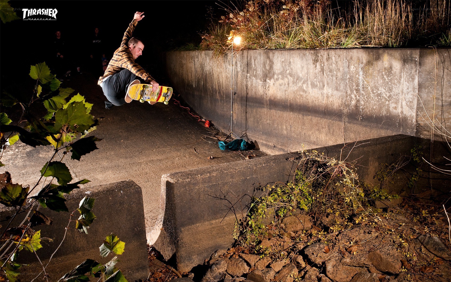 Skater performing trick at night
