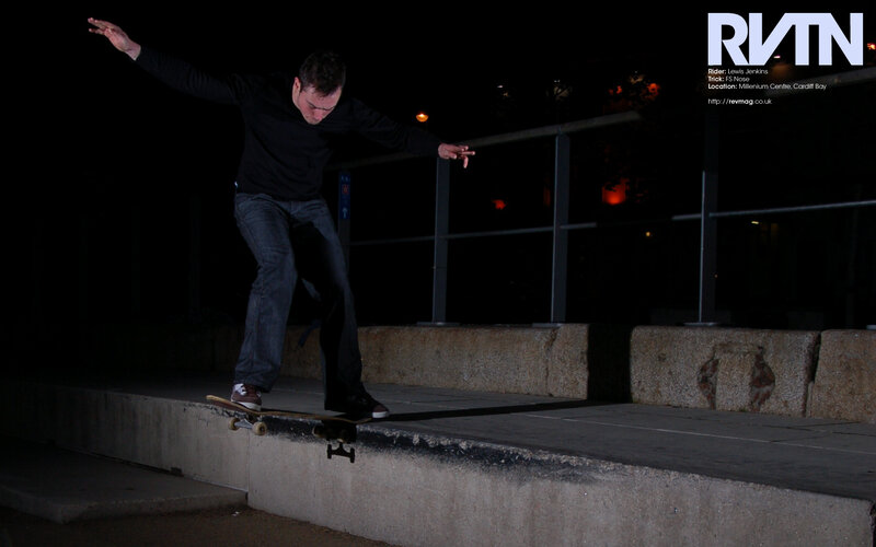 Skater performing trick at night
