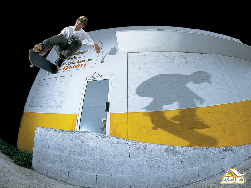 skater performing trick at night