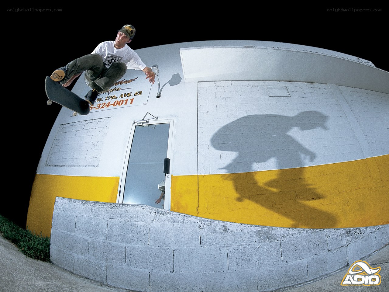 skater performing trick at night