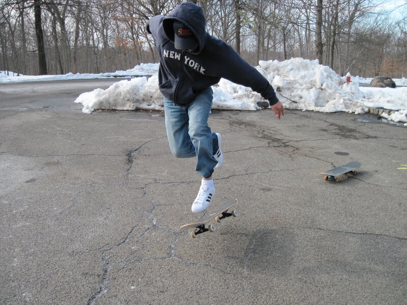 skater performing trick in winter