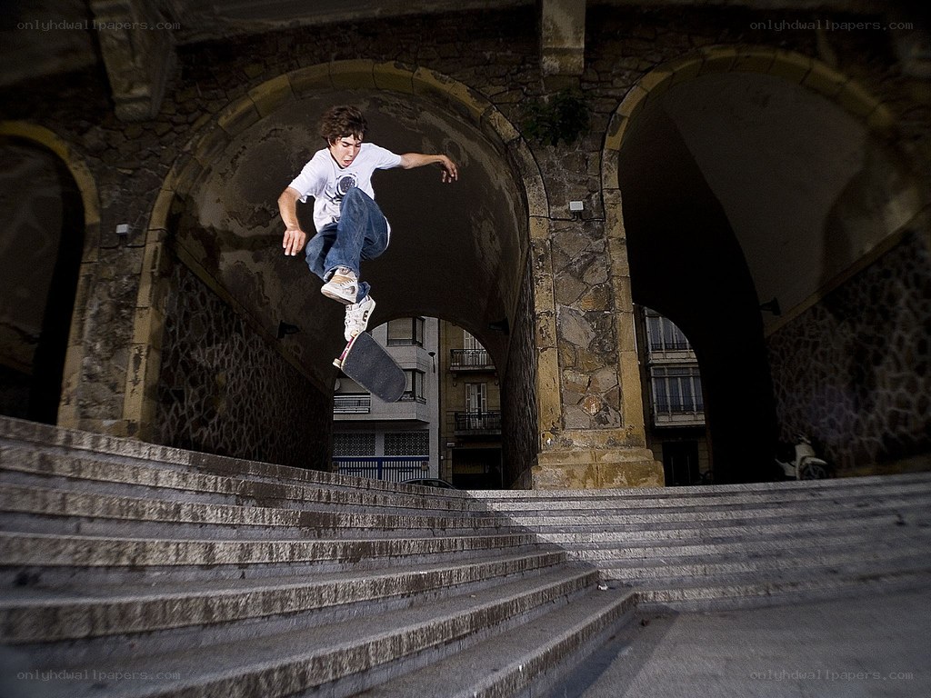 Skater performing trick on stairs