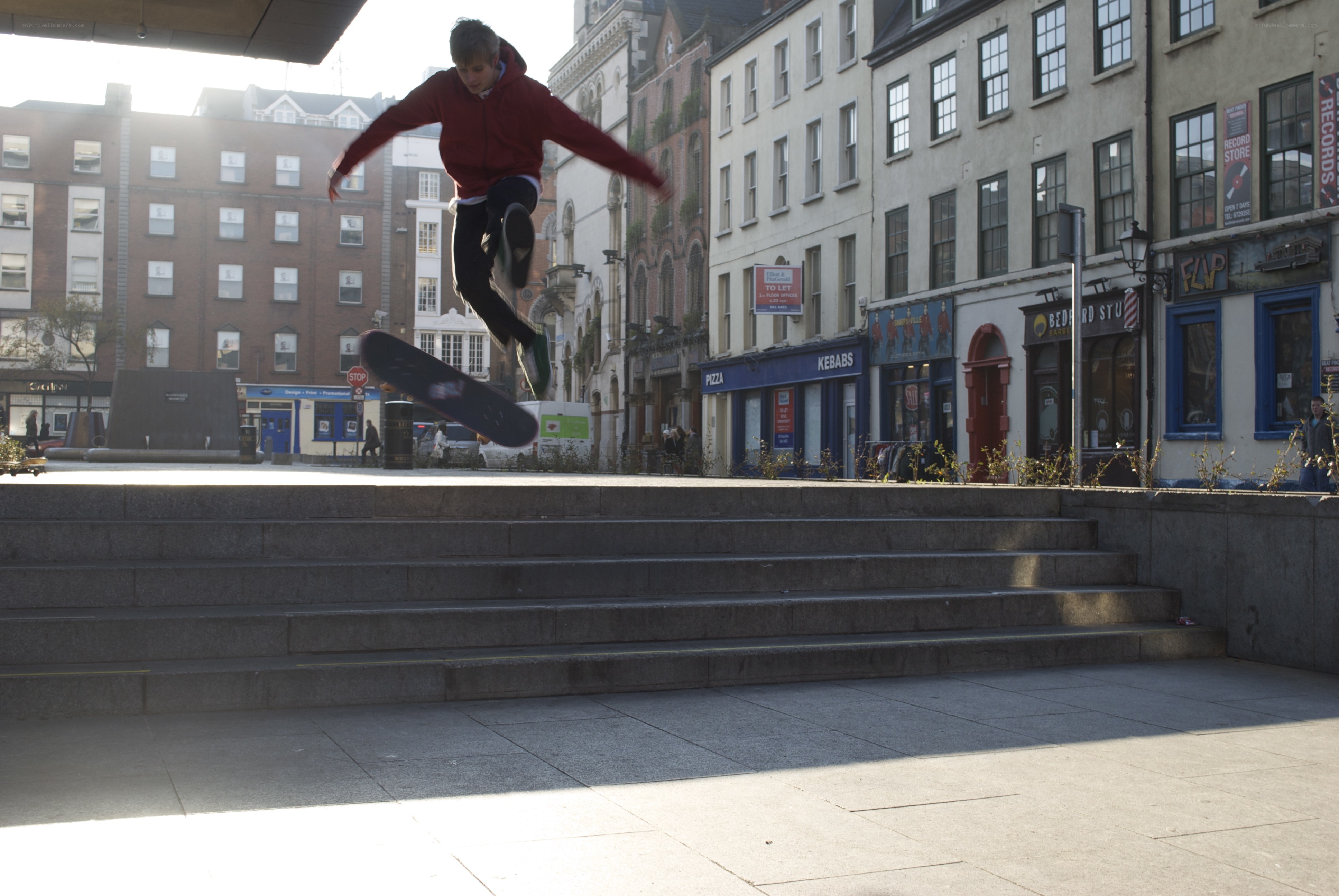 Skater performing trick on stairs