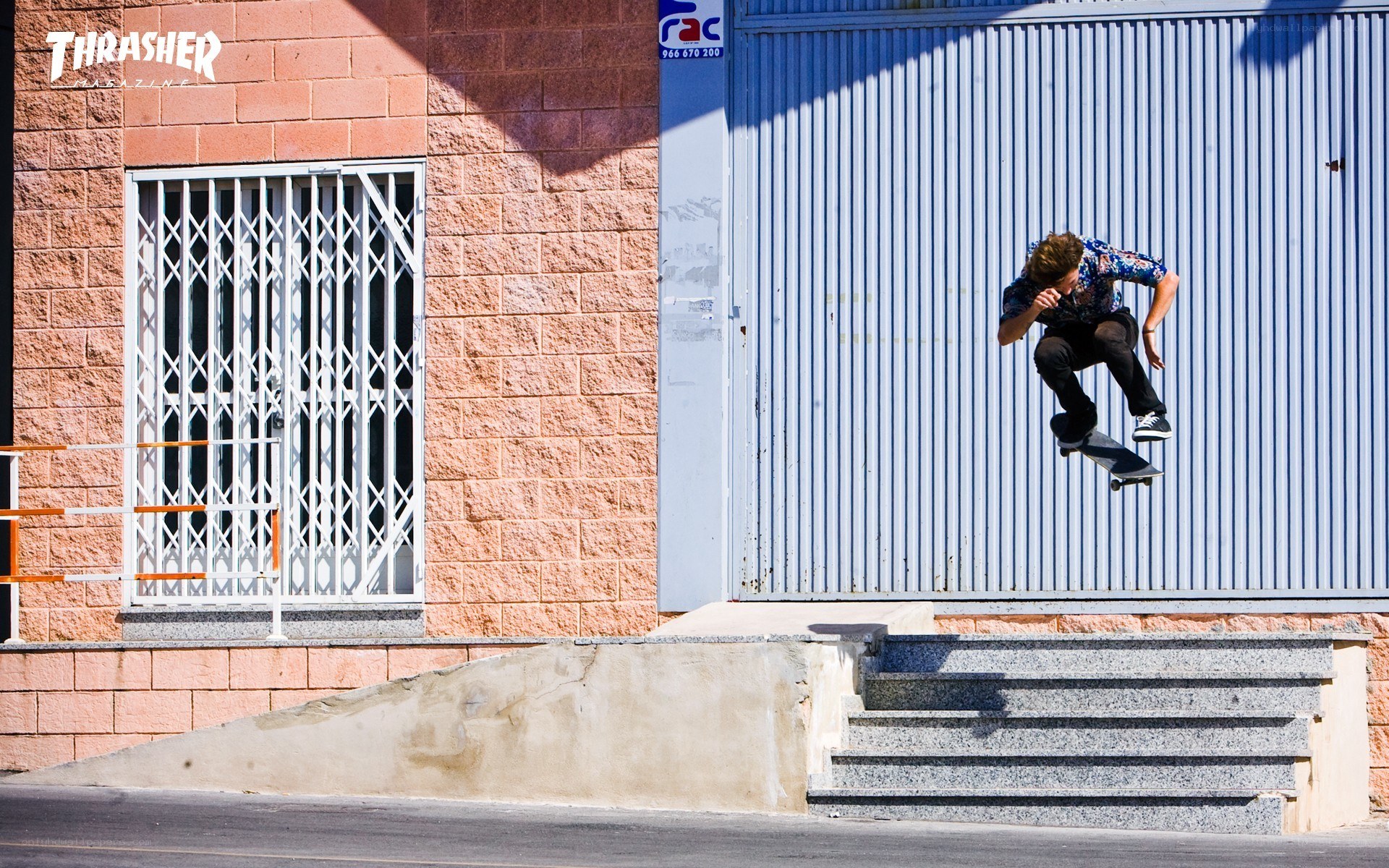 Skater performing trick on stairs