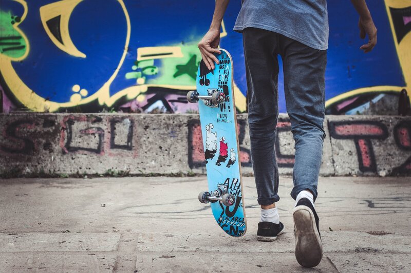 Skater walking with board