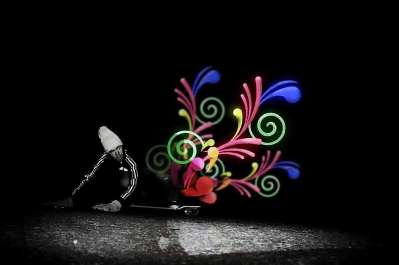 skater with colorful light art