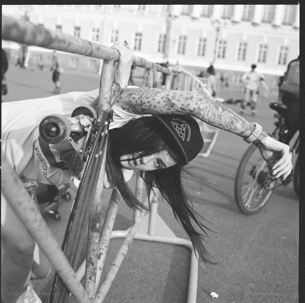 Skater with tattoos on rail