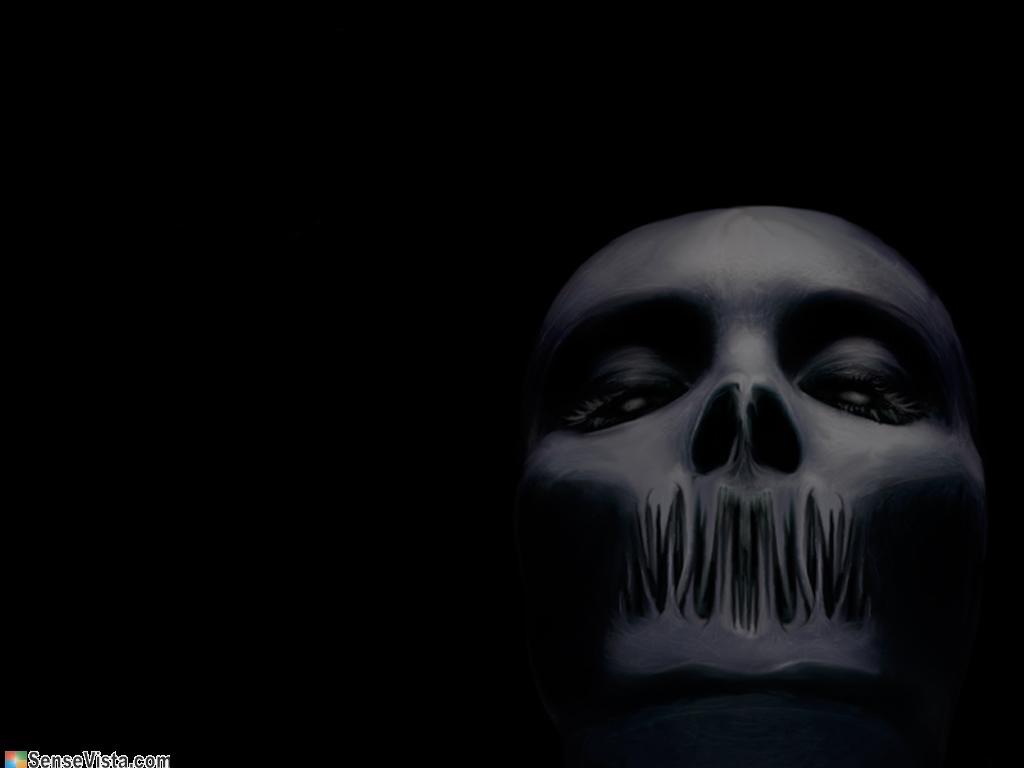 skeletal face in darkness