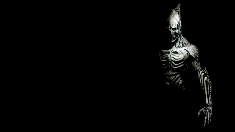 skeletal figure in darkness