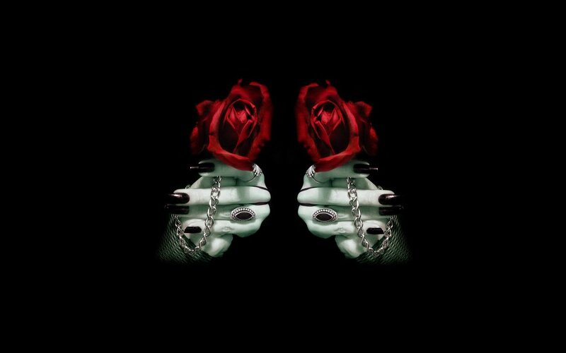 Skeletal Hands Holding Roses