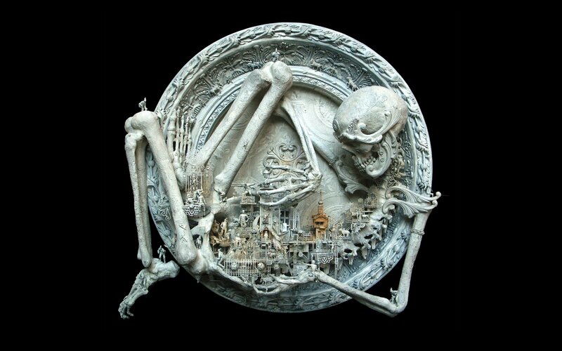 skeletal sculpture with miniature city