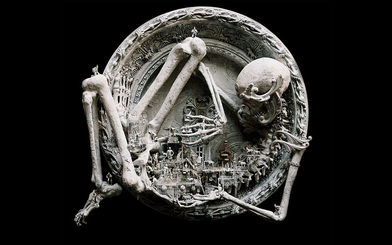 skeletal sculpture with miniature city