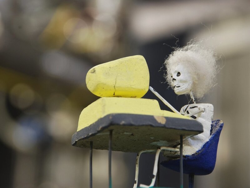 skeleton at a desk sculpture