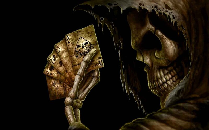 skeleton holding playing cards